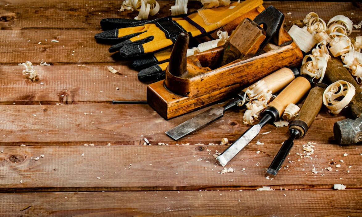 Working tool on wood with sawdust.